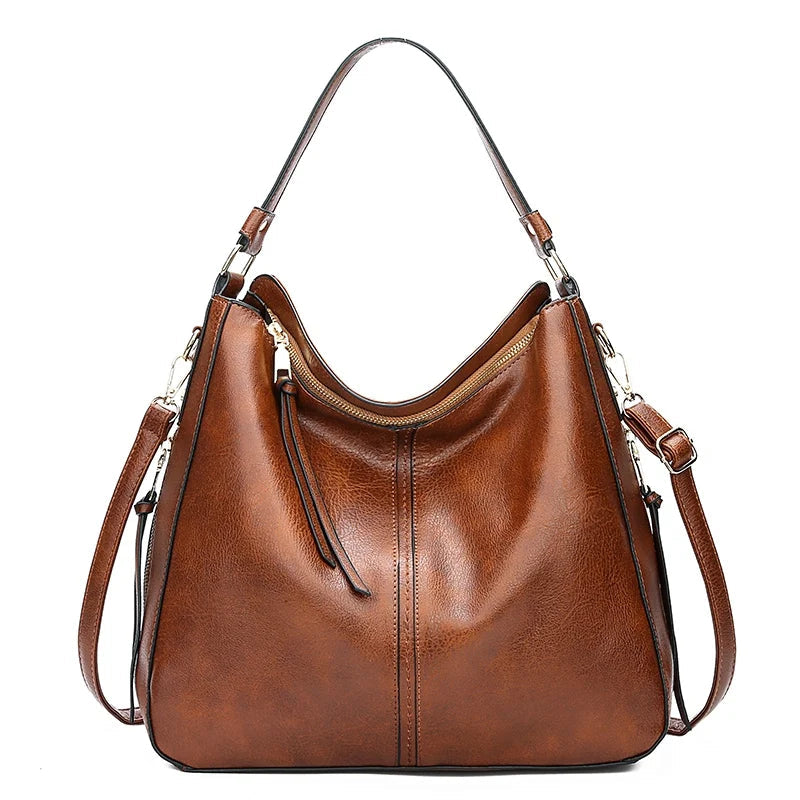 A woman holding a timeless classic handbag with a rich finish by her side