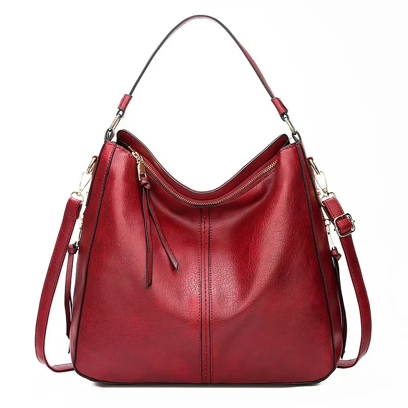 A woman holding a timeless classic handbag with a rich finish by her side