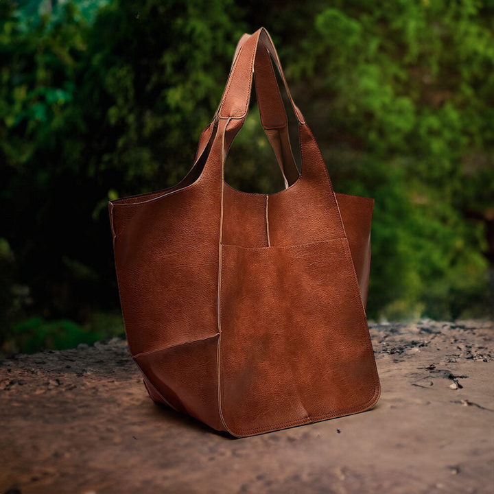 A woman carrying a vintage-style bag with a rich finish on a day out