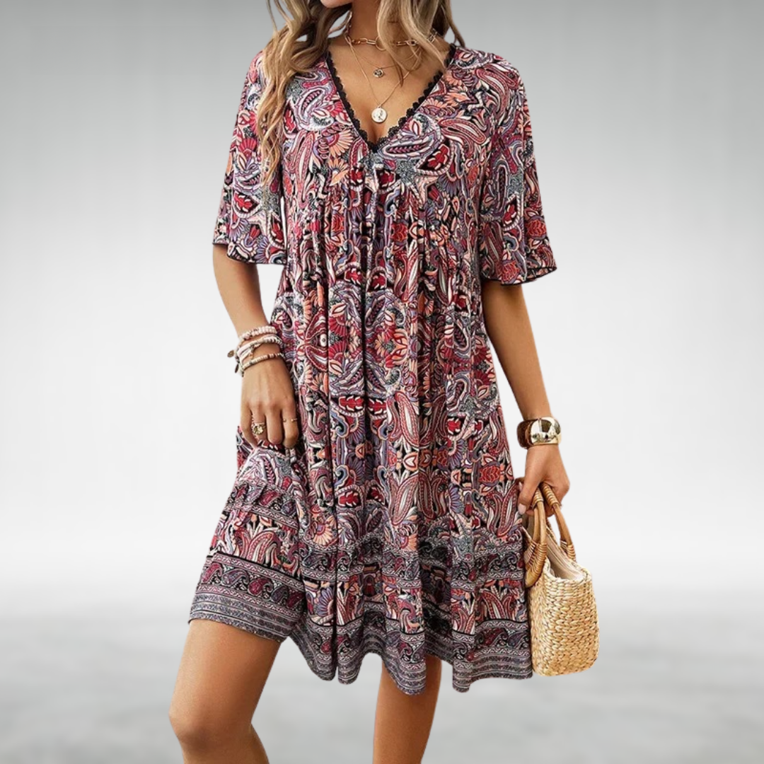 Woman in a patterned boho swing dress with a V-neckline, moving with an easy sway.