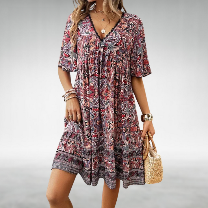 Woman in a patterned boho swing dress with a V-neckline, moving with an easy sway.