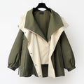 A woman wearing a lightweight weatherproof jacket with an adjustable hem on a blustery day.