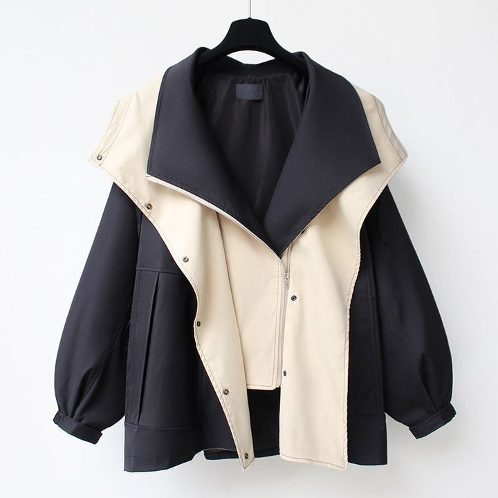 A woman wearing a lightweight weatherproof jacket with an adjustable hem on a blustery day.