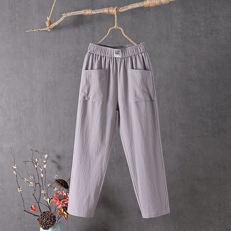 Relaxed tapered pants with roomy front patch pockets and an elastic waist.