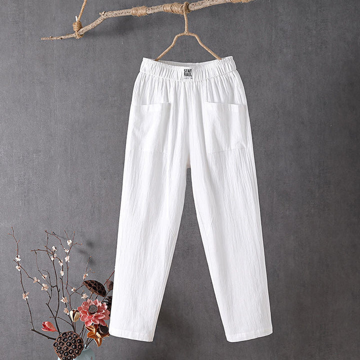 Relaxed tapered pants with roomy front patch pockets and an elastic waist.
