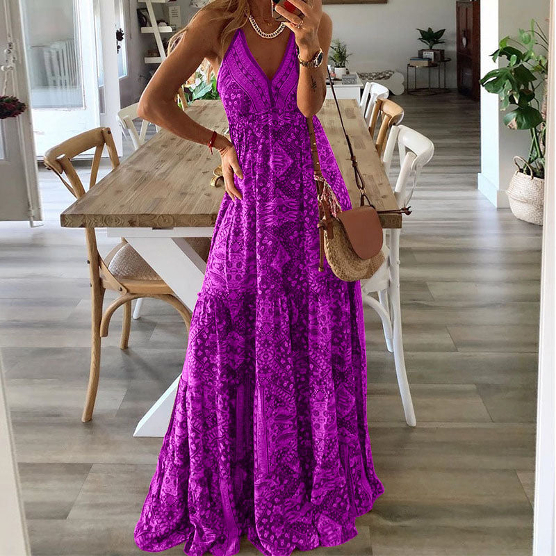 A woman wearing the Kelly sleeveless boho maxi dress with adjustable straps and a flowing tiered skirt.