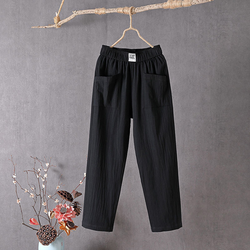 Relaxed tapered pants with roomy front patch pockets and an elastic waist.