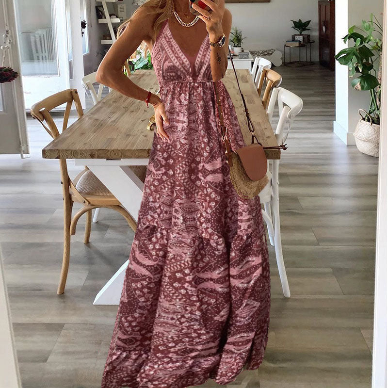 A woman wearing the Kelly sleeveless boho maxi dress with adjustable straps and a flowing tiered skirt.