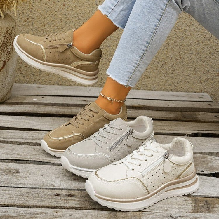 A woman standing comfortably in orthopaedic arch support sneakers.