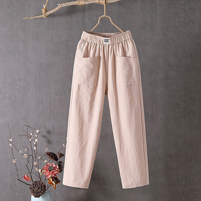 Relaxed tapered pants with roomy front patch pockets and an elastic waist.