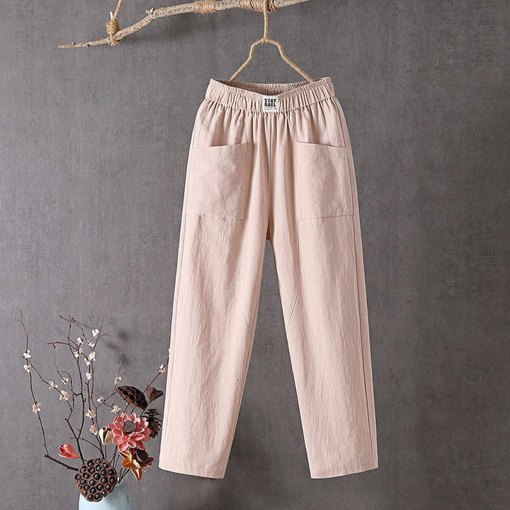 Relaxed tapered pants with roomy front patch pockets and an elastic waist.