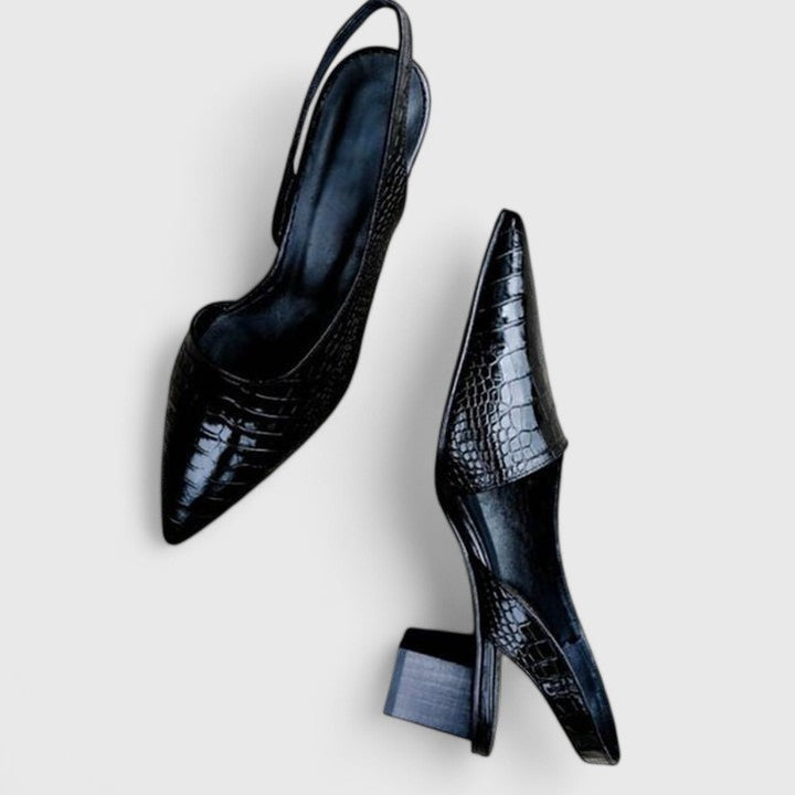 A glossy black croc-effect pointed-toe slingback with a low block heel, shown at an angle.