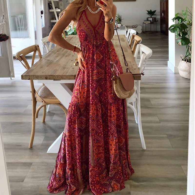 A woman wearing the Kelly sleeveless boho maxi dress with adjustable straps and a flowing tiered skirt.