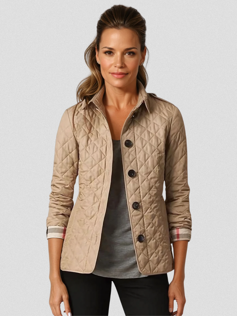 A woman wearing an fall jacket over a top, layered for a crisp day in town.