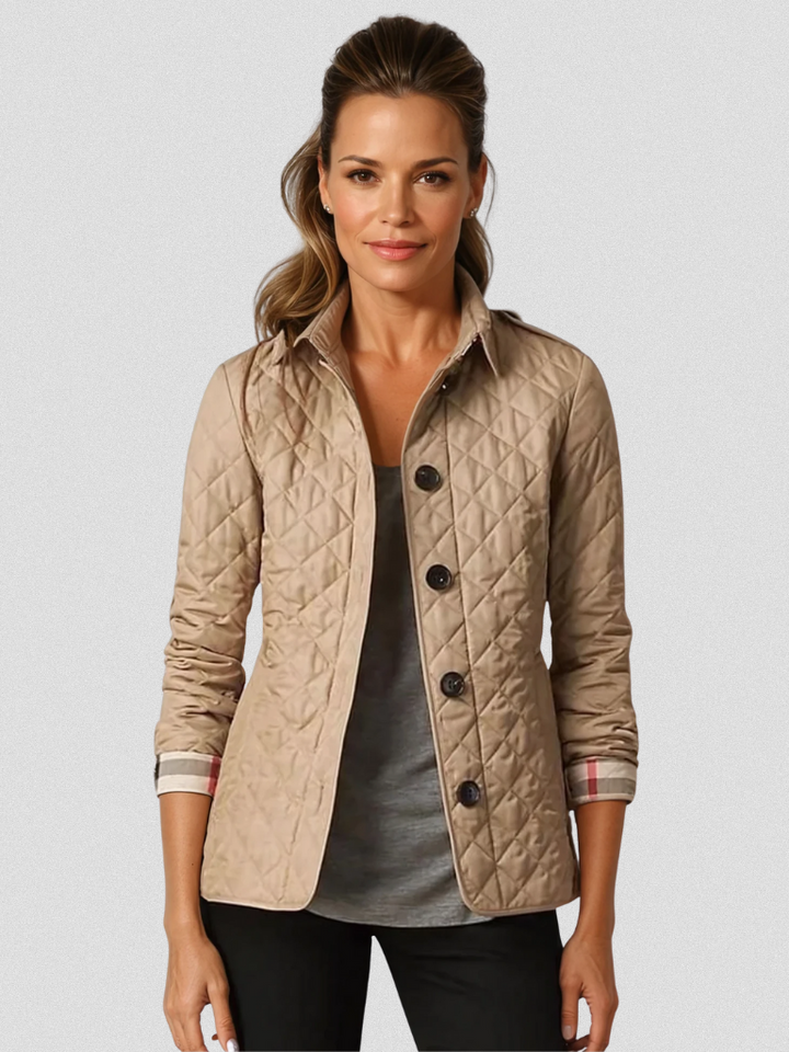 A woman wearing an fall jacket over a top, layered for a crisp day in town.