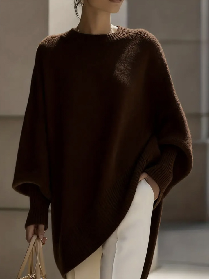 A woman wearing a soft crew neck sweater with jeans for a warm, easy everyday look.