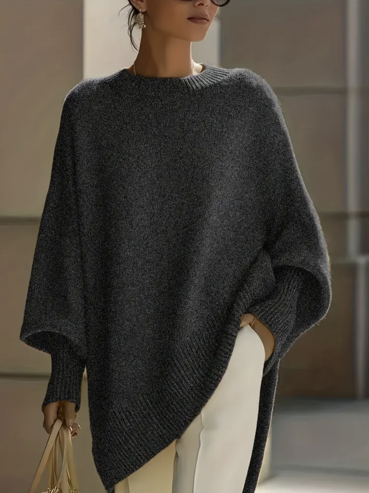 A woman wearing a soft crew neck sweater with jeans for a warm, easy everyday look.