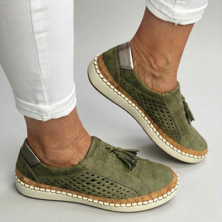 A woman wearing comfortable orthopaedic slip-on shoes on a summer day