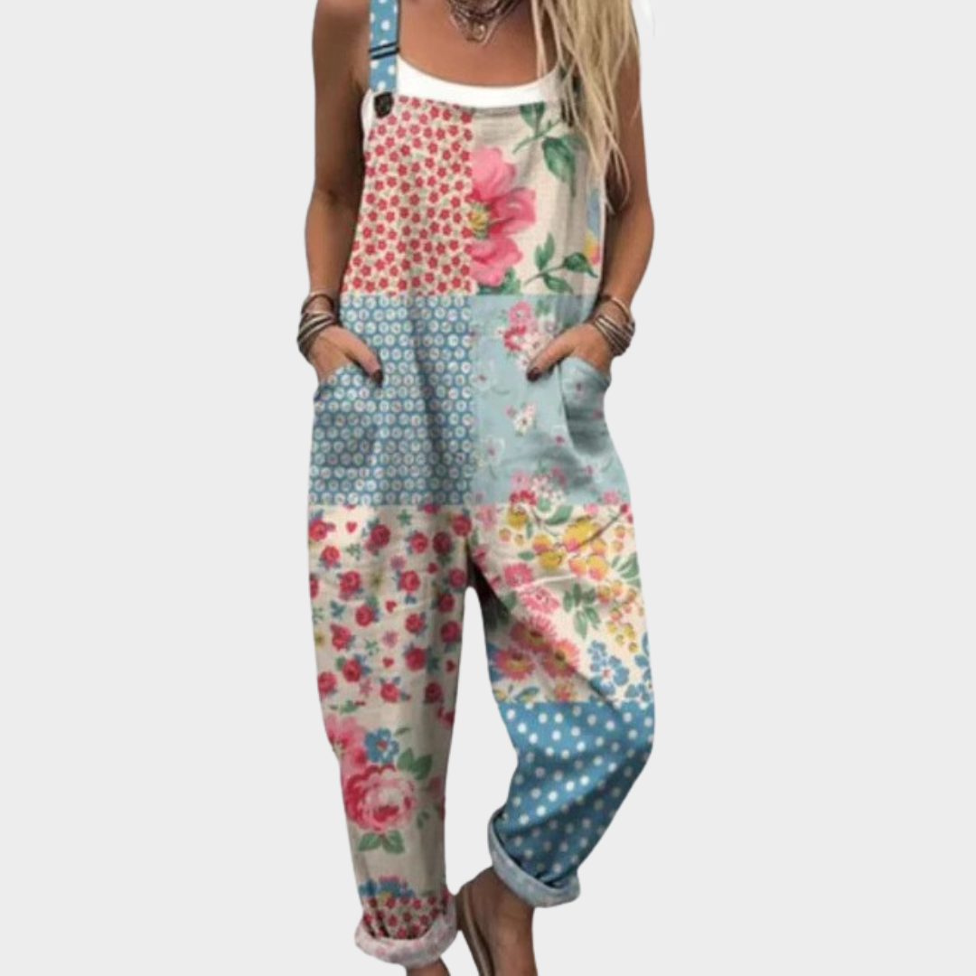 Woman wearing pastel boho patchwork overalls with flowers, dots and checks, adjustable straps, cheerful and relaxed.