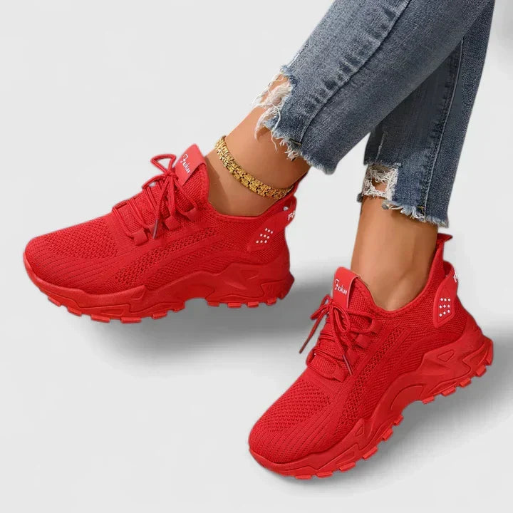 A woman wearing wide-toe cushioned orthopaedic sneakers