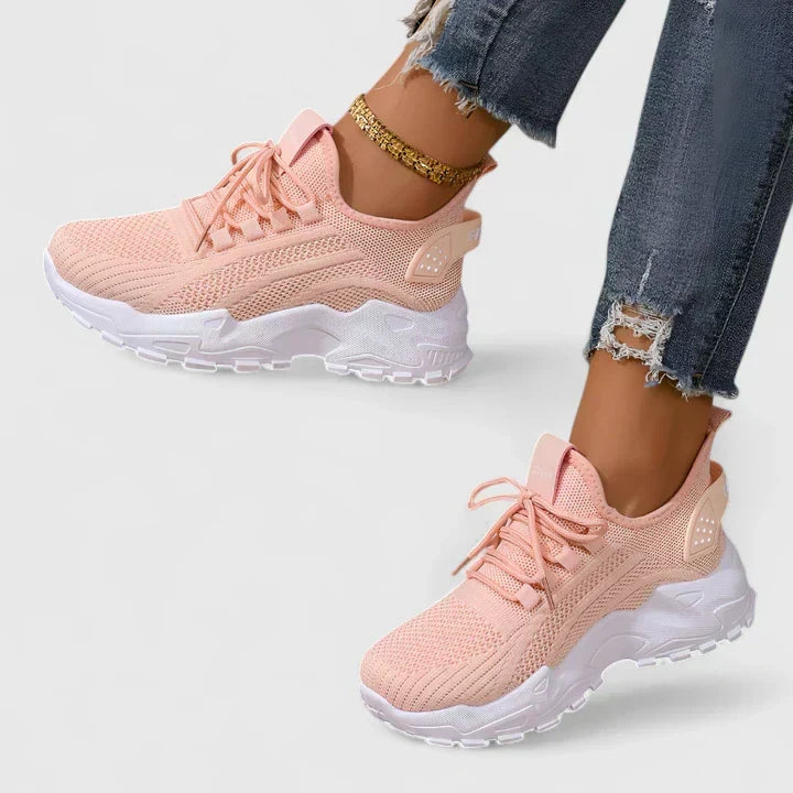 A woman wearing wide-toe cushioned orthopaedic sneakers