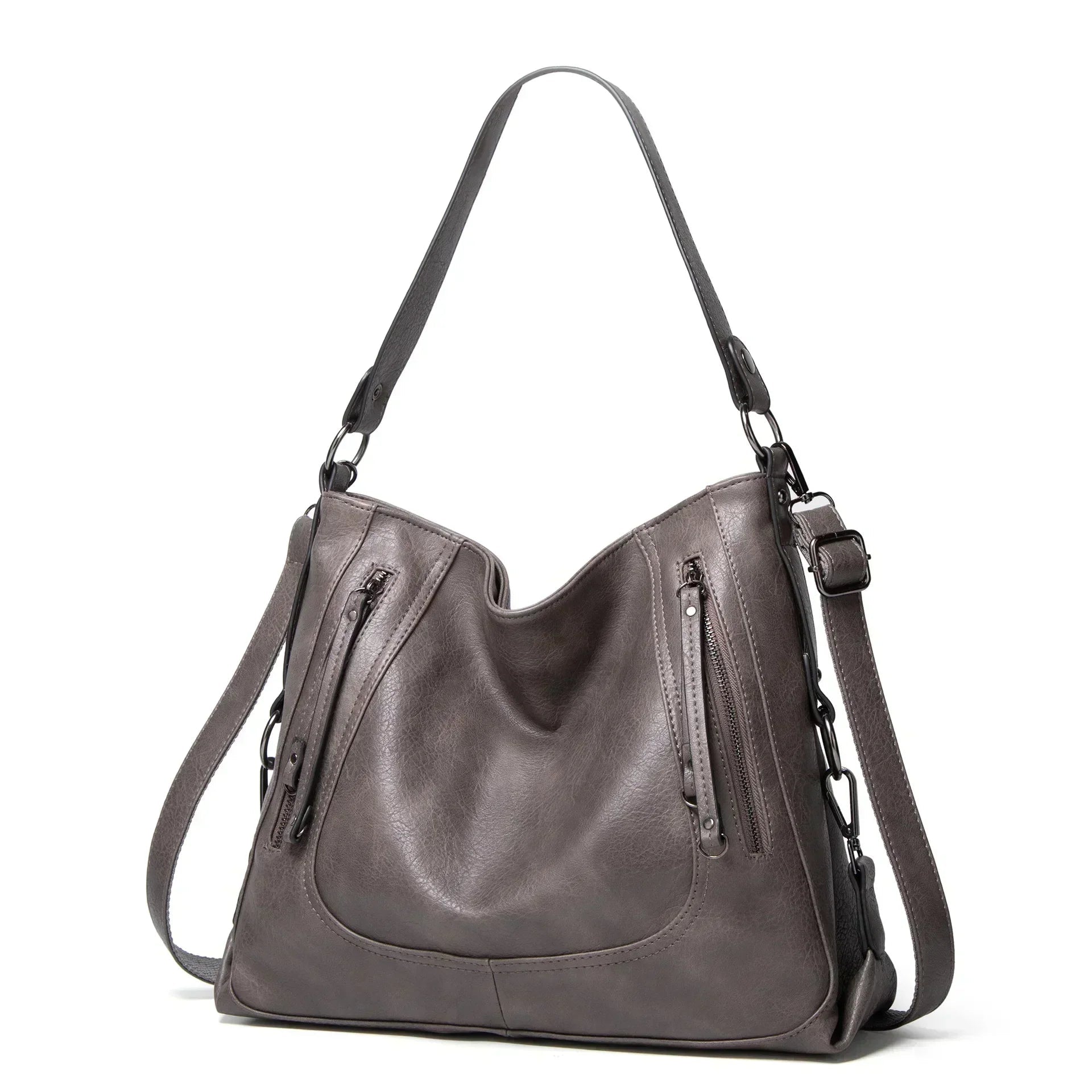 A woman wearing a crisp white elegant shoulder bag over her shoulder at an afternoon event.