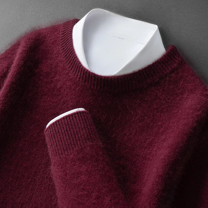 A woman wearing a soft warm sweater layered over a shirt on a cold day.