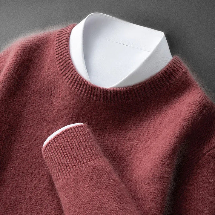 A woman wearing a soft warm sweater layered over a shirt on a cold day.