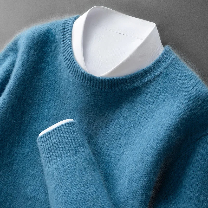 A woman wearing a soft warm sweater layered over a shirt on a cold day.