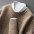 A woman wearing a soft warm sweater layered over a shirt on a cold day.