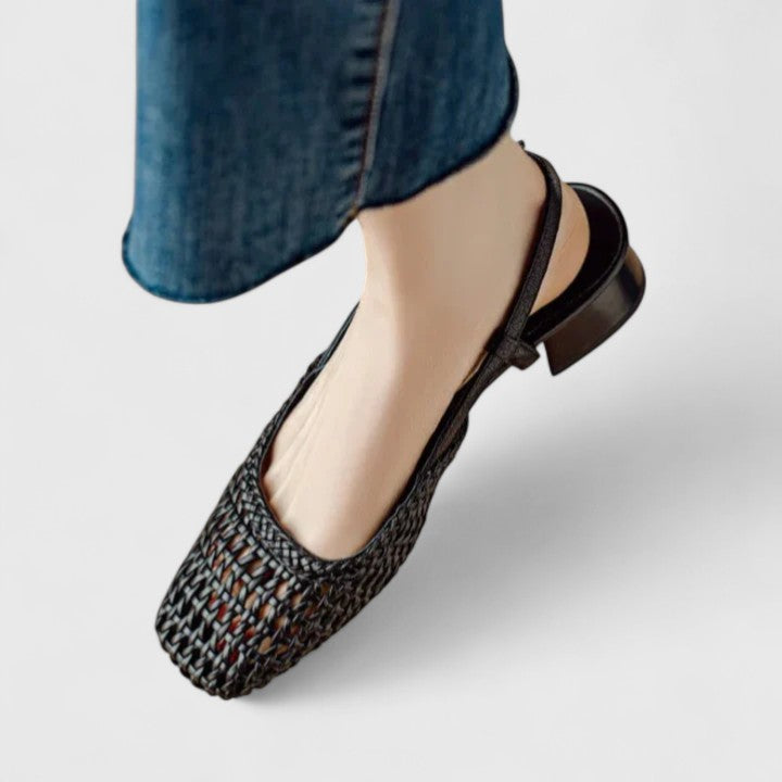A woman wearing woven ballet flats with a square toe on an easy day out.