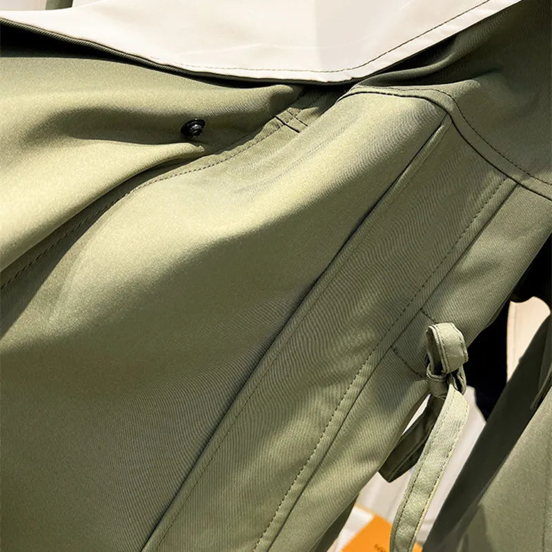 A woman wearing a lightweight weatherproof jacket with an adjustable hem on a blustery day.