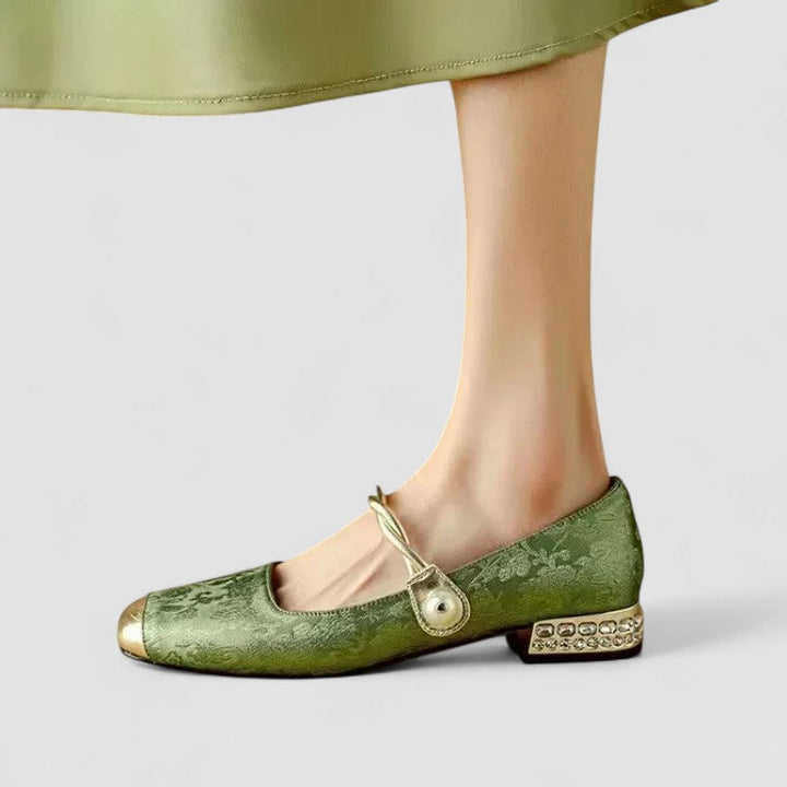 A woman wearing embellished green Mary Jane flats at a special occasion.