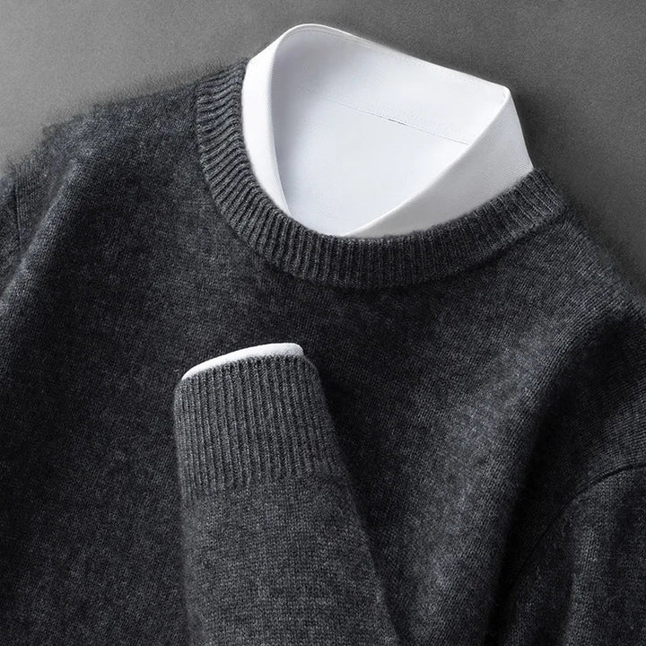 A woman wearing a soft warm sweater layered over a shirt on a cold day.