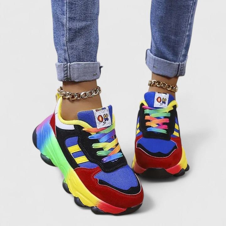 A woman wearing colourful cushioned orthopaedic lace-up shoes