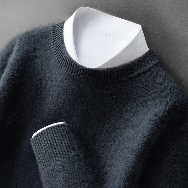 A woman wearing a soft warm sweater layered over a shirt on a cold day.