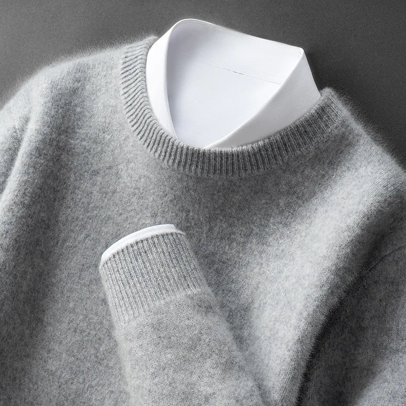 A woman wearing a soft warm sweater layered over a shirt on a cold day.