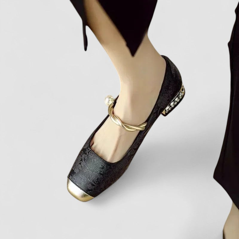 A woman in sparkling Mary Jane shoes with a low block heel at an evening celebration.