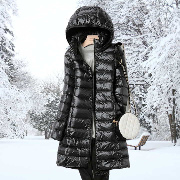 A rail of ultra-light padded hooded coats in pink, red, khaki and black, knee-skimming in length.