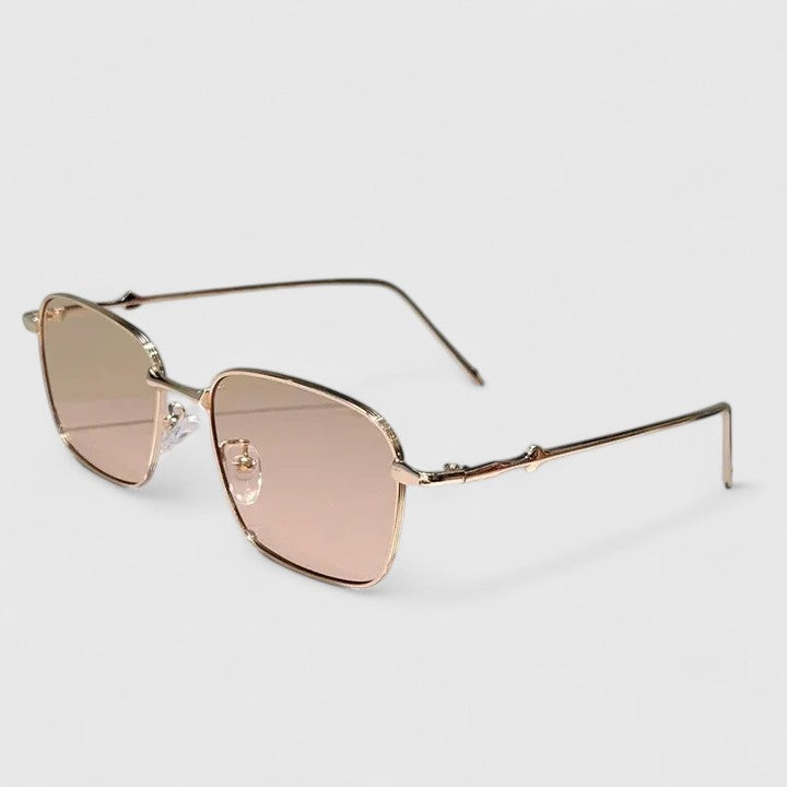 A woman on a sunny street wearing classic square gradient sunglasses, confident and stylish.