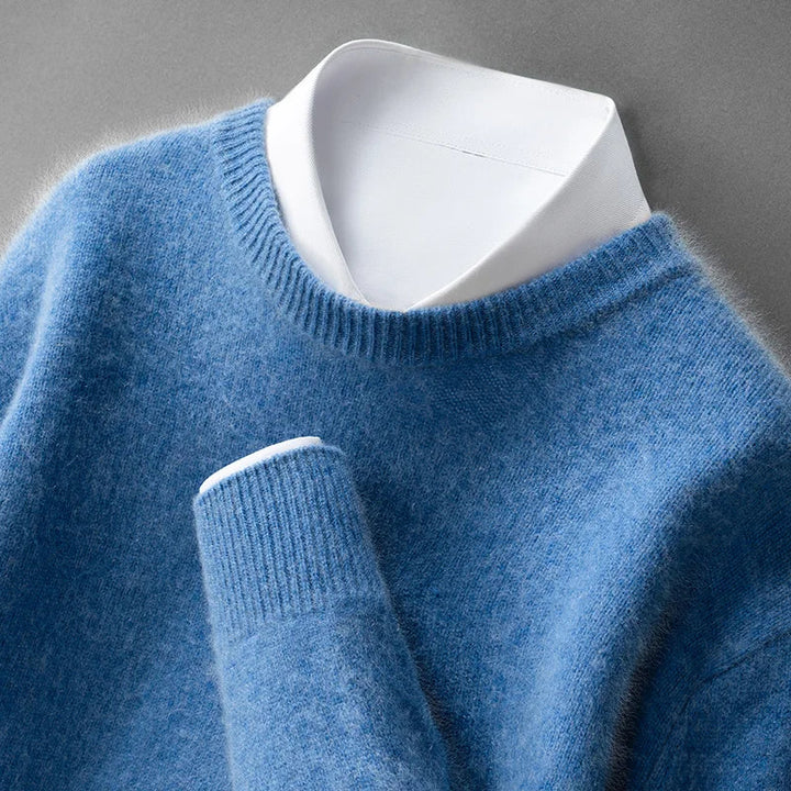 A woman wearing a soft warm sweater layered over a shirt on a cold day.