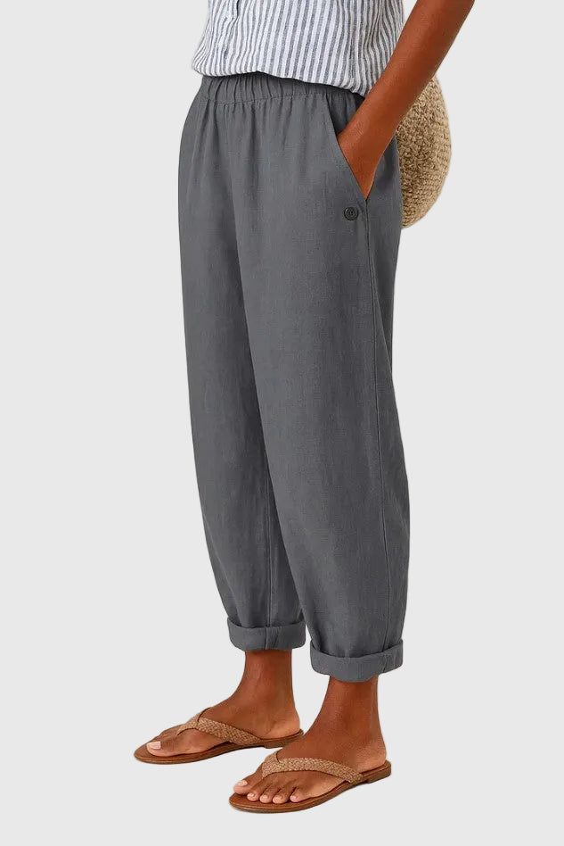 A woman wearing chic comfy pants with a modern relaxed cut and flattering silhouette.