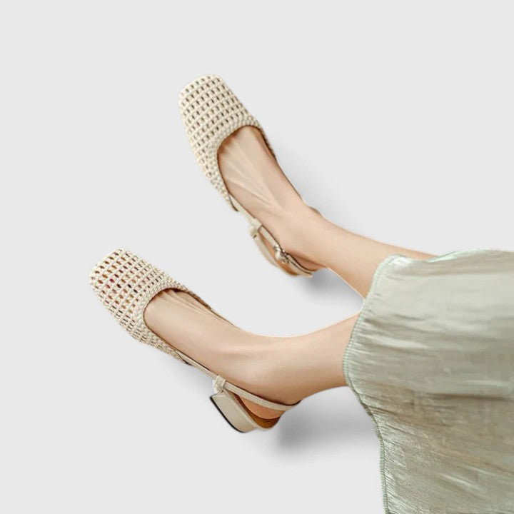 A woman wearing woven ballet flats with a square toe on an easy day out.