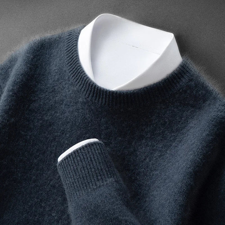 A woman wearing a soft warm sweater layered over a shirt on a cold day.