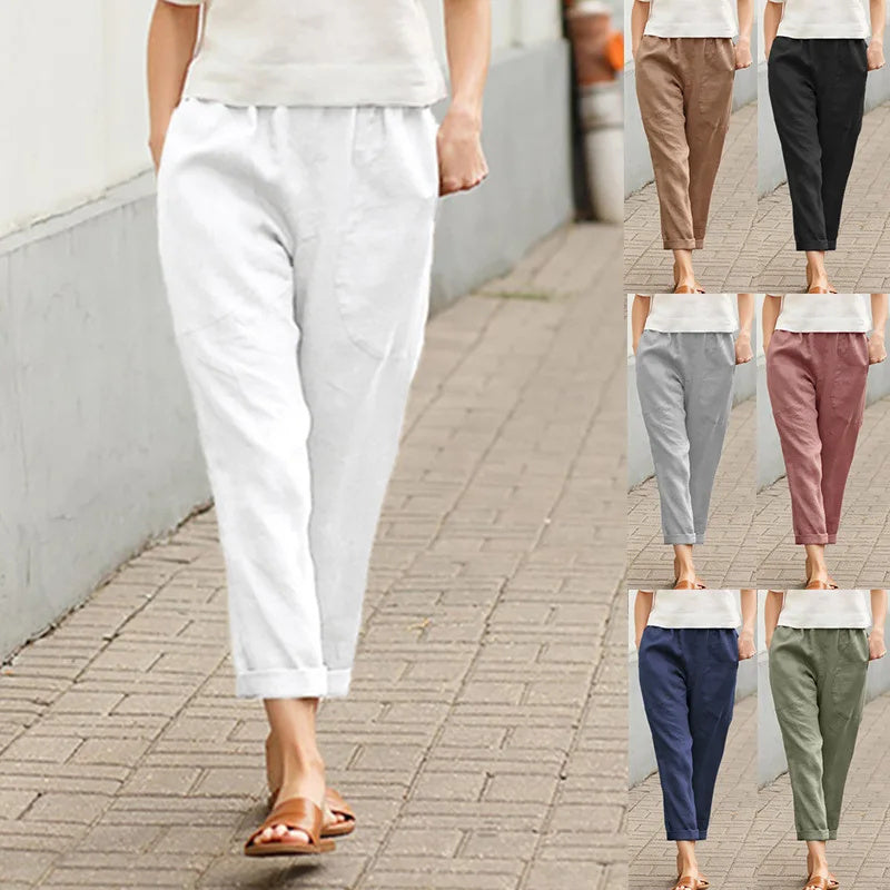 A woman wearing wide relaxed pants with two roomy pockets and an elastic waist.
