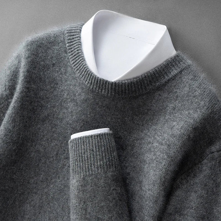 A woman wearing a soft warm sweater layered over a shirt on a cold day.