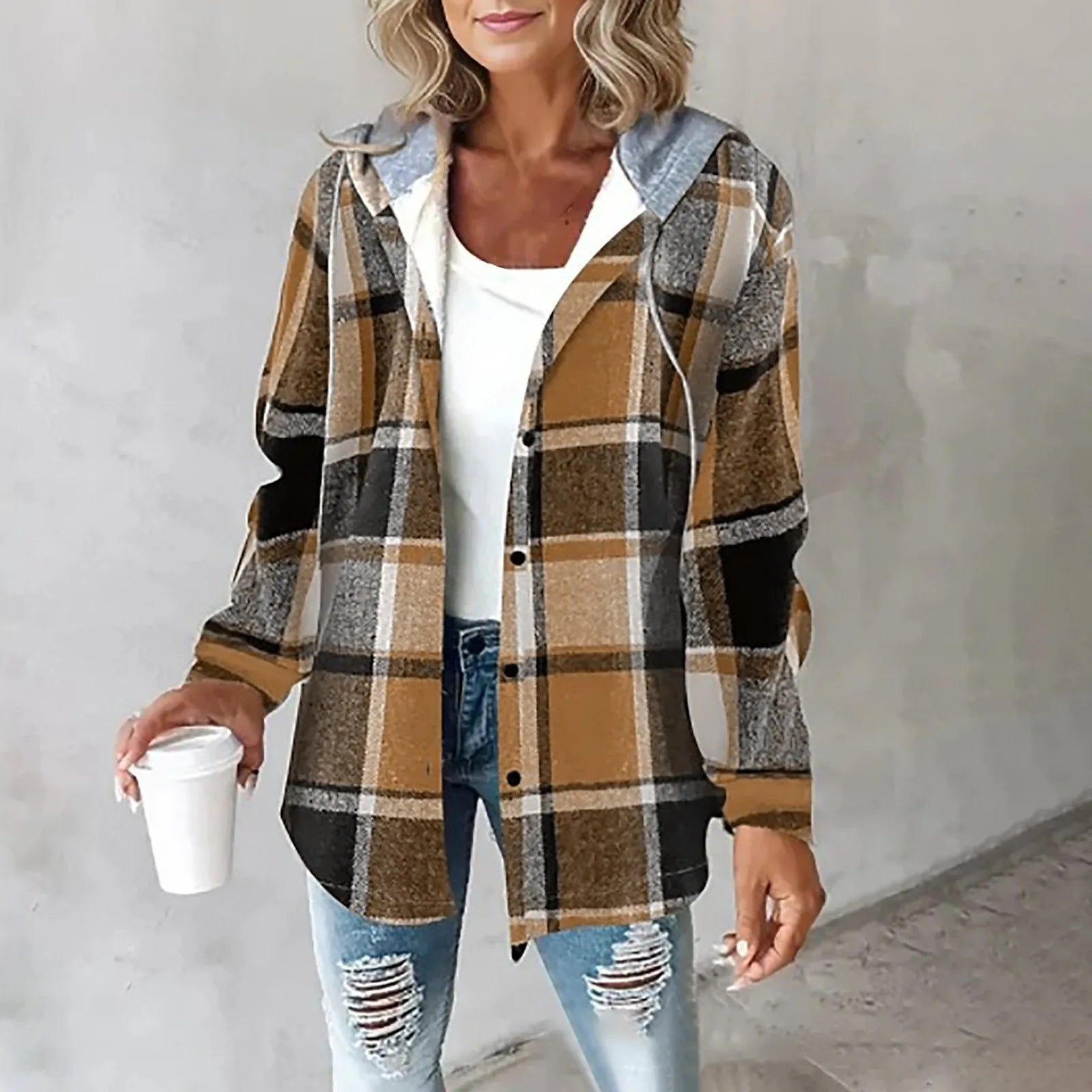 A woman wearing a grey and white checked hooded jacket with a button front
