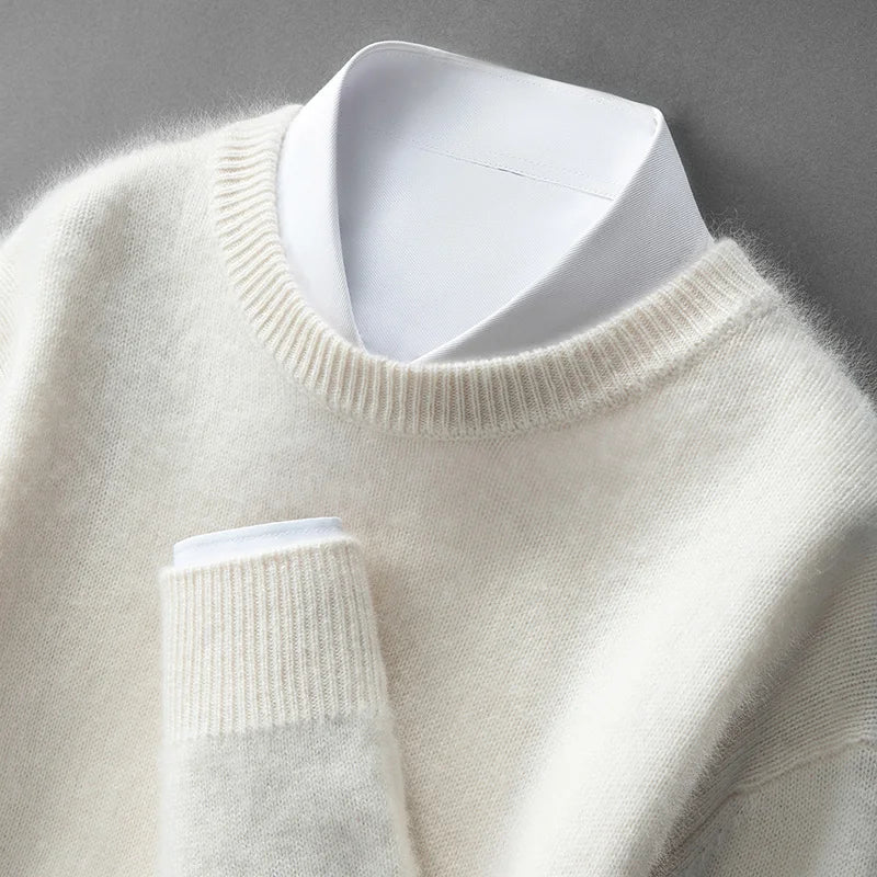 A woman wearing a soft warm sweater layered over a shirt on a cold day.