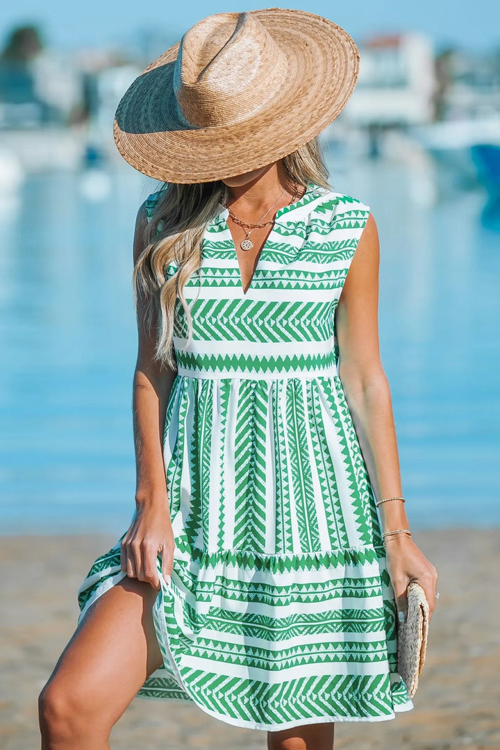 Woman in a geometric print A-line summer dress enjoying a sunny day out.