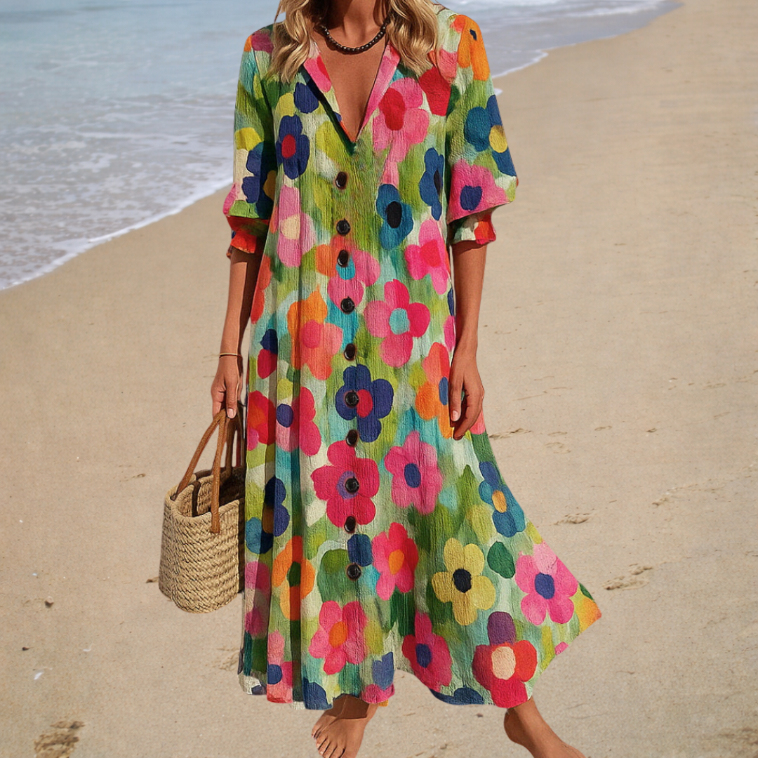 Woman wearing a romantic bohemian maxi dress with delicate patterns and a softly draped silhouette.